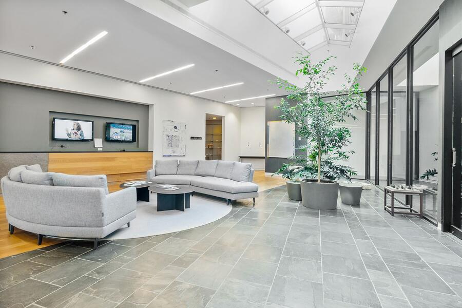 A clinic lobby behind a glass partition