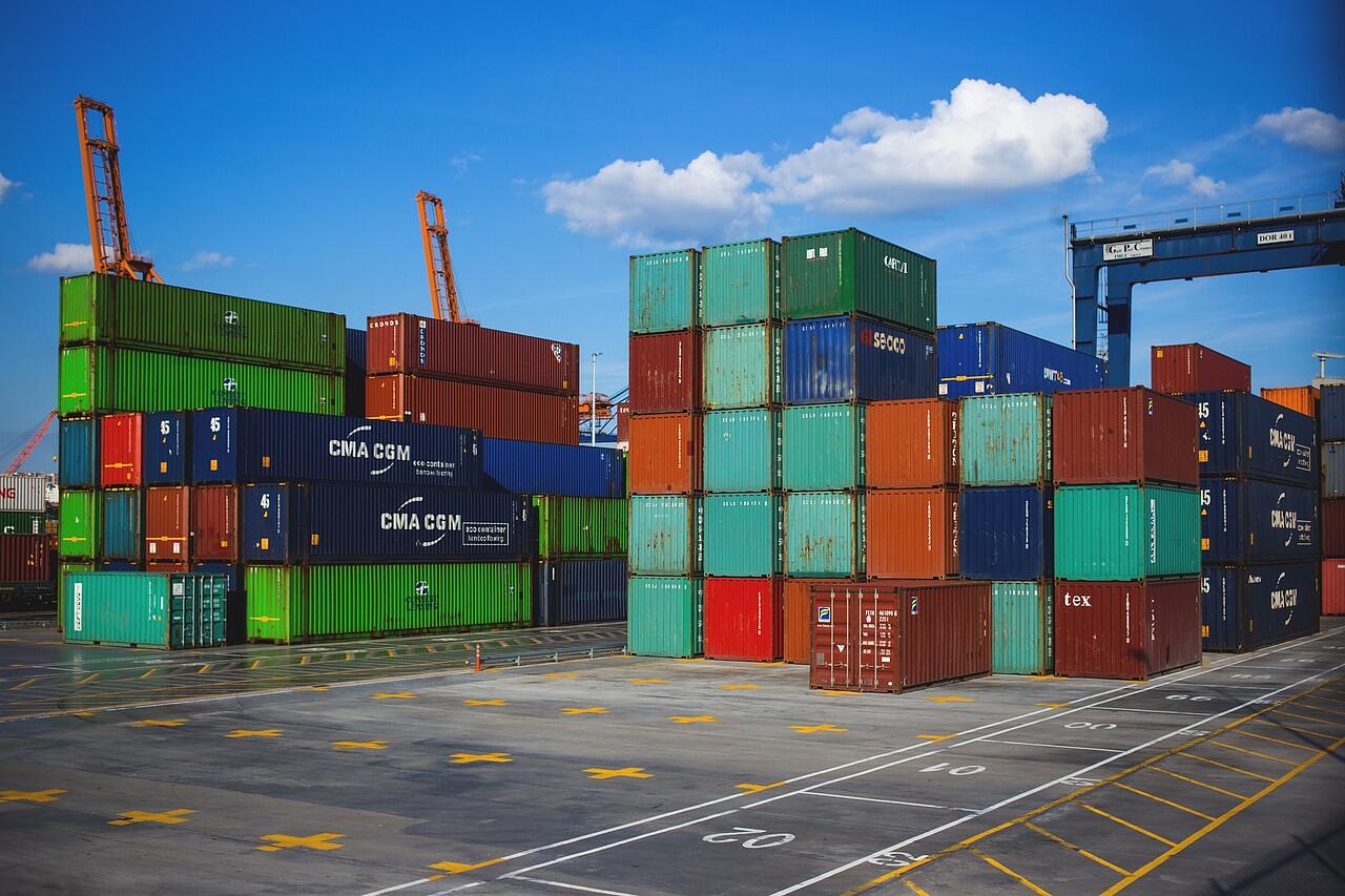 Stacked shipping containers at a logistics yard